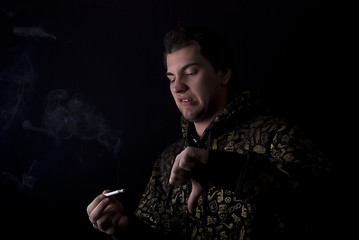 Image showing portrait of a young man with cigarette