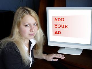 Image showing Blond girl and computer monitor