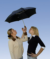 Image showing 2 women under the umbrella