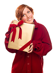 Image showing Pretty Red Haired Girl with Wrapped Gift Isolated