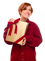 Image showing Pretty Red Haired Girl with Wrapped Gift Isolated