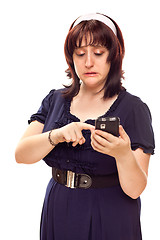 Image showing Reluctant Young Caucasian Woman Texting On Mobile Phone