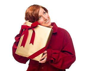 Image showing Pretty Red Haired Girl with Wrapped Gift Isolated