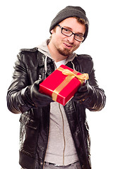 Image showing Warmly Dressed Young Man Handing Wrapped Gift Out