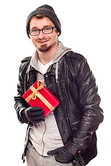 Image showing Warmly Dressed Handsome Young Adult Holding Gift