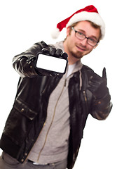 Image showing Man with Santa Hat Holding Out Blank Cell Phone