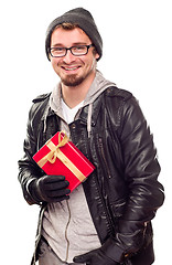 Image showing Warmly Dressed Handsome Young Adult Holding Gift