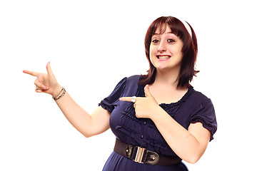 Image showing Happy Young Caucasian Woman Pointing to the Side on White