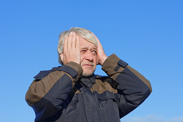 Image showing Portrait of middle-aged man on blue sky of the background.