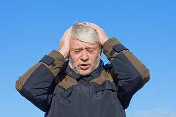 Image showing Portrait of middle-aged man on blue sky of the background.