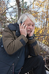 Image showing Mature middle-aged man in forest.