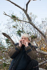 Image showing Mature middle-aged man in forest.