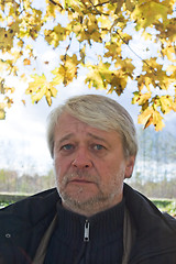 Image showing Portrait of middle-aged man in autumn day.