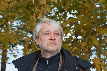Image showing Portrait of middle-aged man in autumn day.