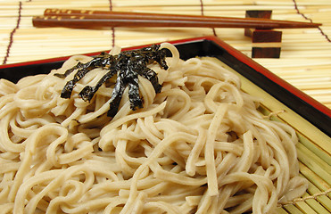Image showing Soba and chopsticks on a bamboo floor