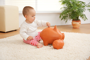 Image showing Little boy's early savings