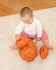 Image showing Playing with piggy banks