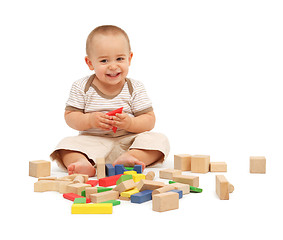 Image showing Little boy playing with blocks