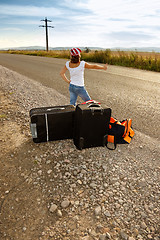 Image showing Young hitch-hiker girl