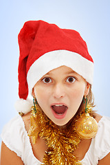 Image showing Christmas wondering girl