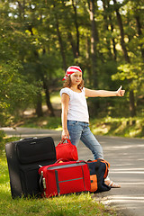 Image showing Young hitch-hiker girl