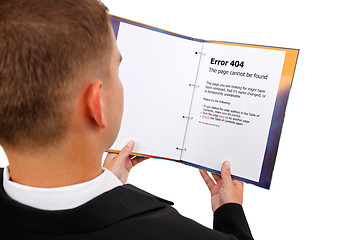 Image showing Looking at 404 error page in book