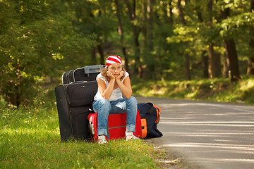 Image showing Young hitch-hiker girl