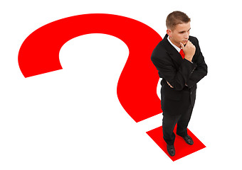 Image showing Businessman standing on question mark
