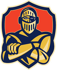 Image showing knight with arms crossed with shield