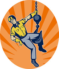 Image showing Construction worker hanging on hook