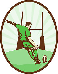 Image showing Rugby player kicking ball