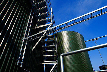 Image showing Industrial zone, Steel pipelines and tanks against blue sky