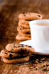 Image showing cup of herbal tea and some fresh cookies