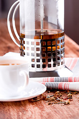 Image showing french press and cup of fresh herbal tea 