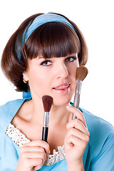 Image showing  woman in blue dress with two make-up brushes