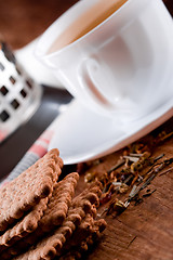 Image showing cup of herbal tea and some fresh cookies