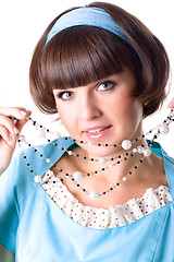 Image showing brunet woman in blue dress with pearl beads