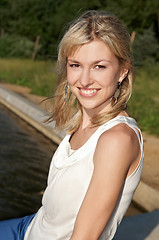 Image showing smiley woman on a lake