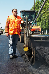 Image showing Young paver worker at asphalting works