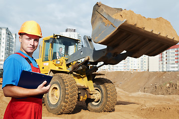 Image showing smiling Builder inspector at construction area