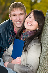 Image showing Portrait of cheerful students outdoors
