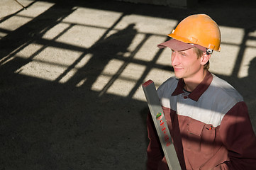 Image showing worker builder with level