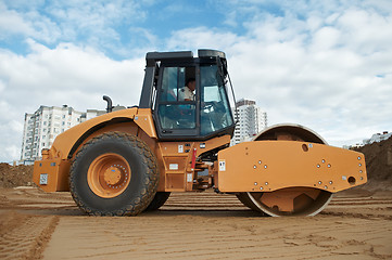 Image showing soil vibration compactor at work