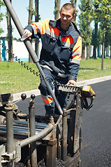 Image showing Young paver worker at asphalting works