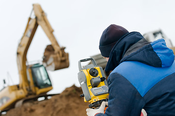 Image showing land surveying with theodolite