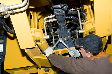 Image showing maintenance work of heavy loader