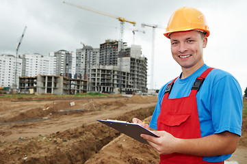 Image showing smiling Builder inspector at construction area