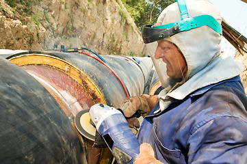 Image showing worker and cutoff saw