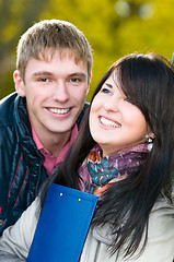 Image showing Portrait of cheerful students outdoors