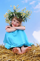 Image showing Happy smiley girl with camomile wreath 